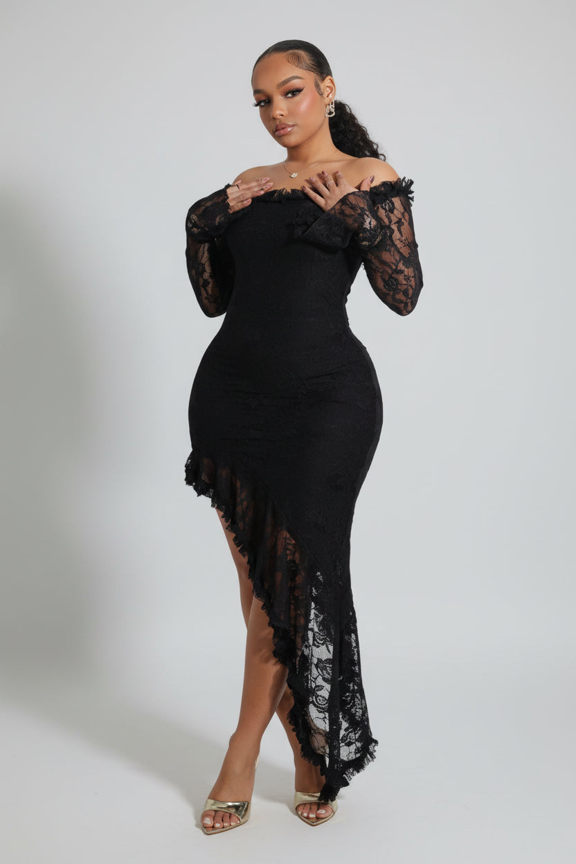 Woman wearing a black lace dress on a white background