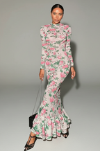 Woman wearing a floral dress with a gray background